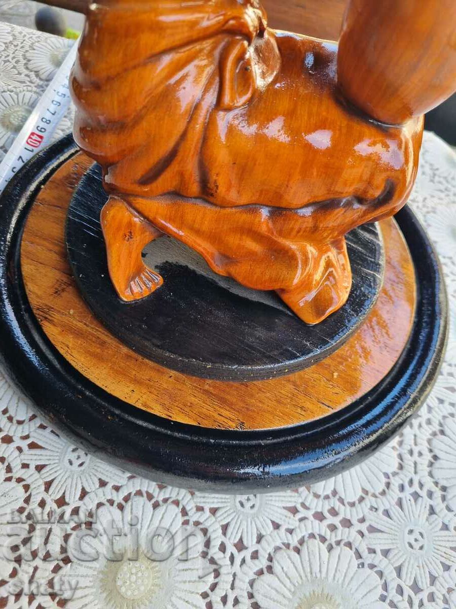 Delivery of Old wooden figure. Sculpture.