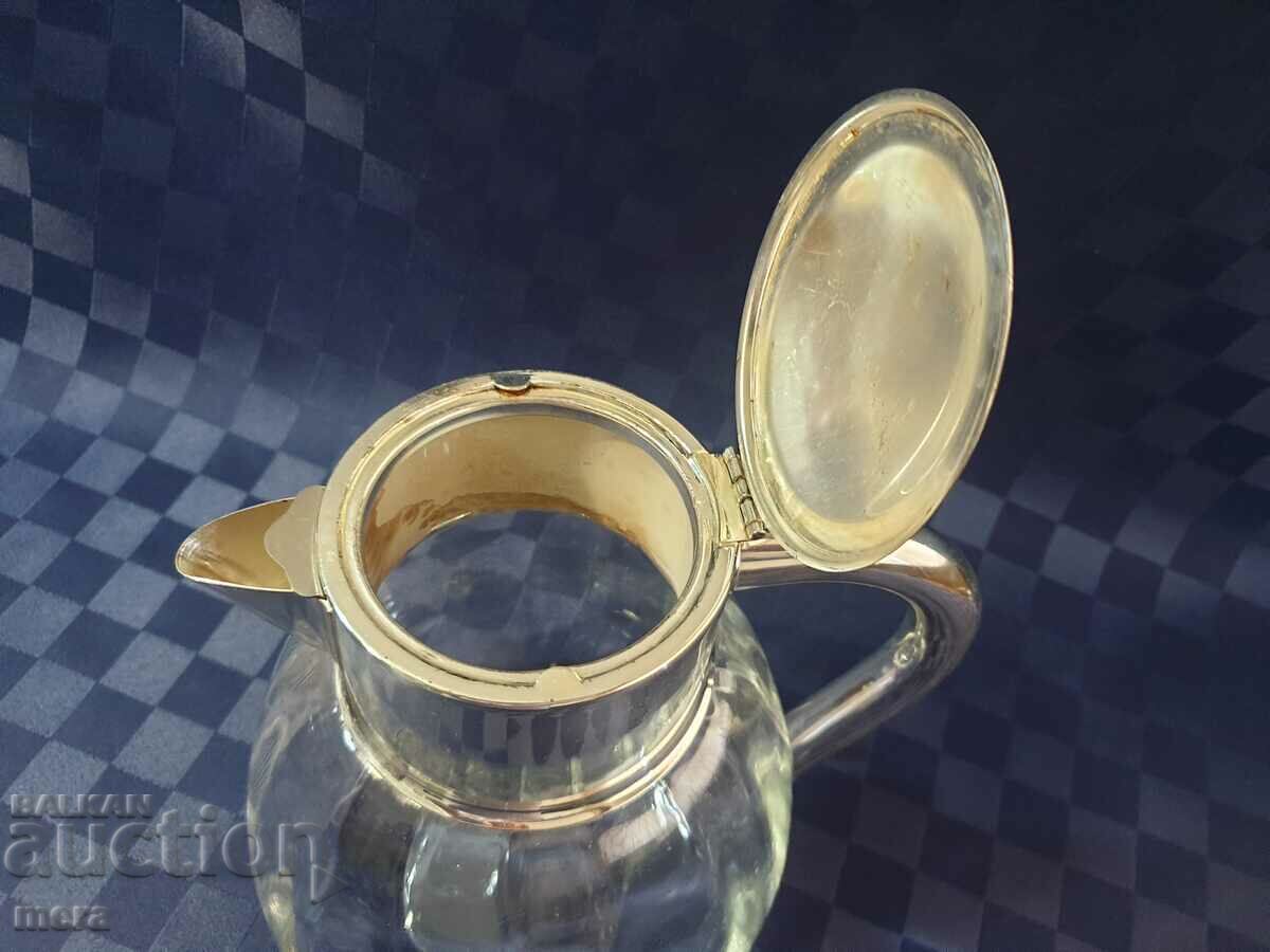 Delivery of Large crystal jug with silver plated metal fittings Delivery of Large crystal jug with silver plated metal fittings