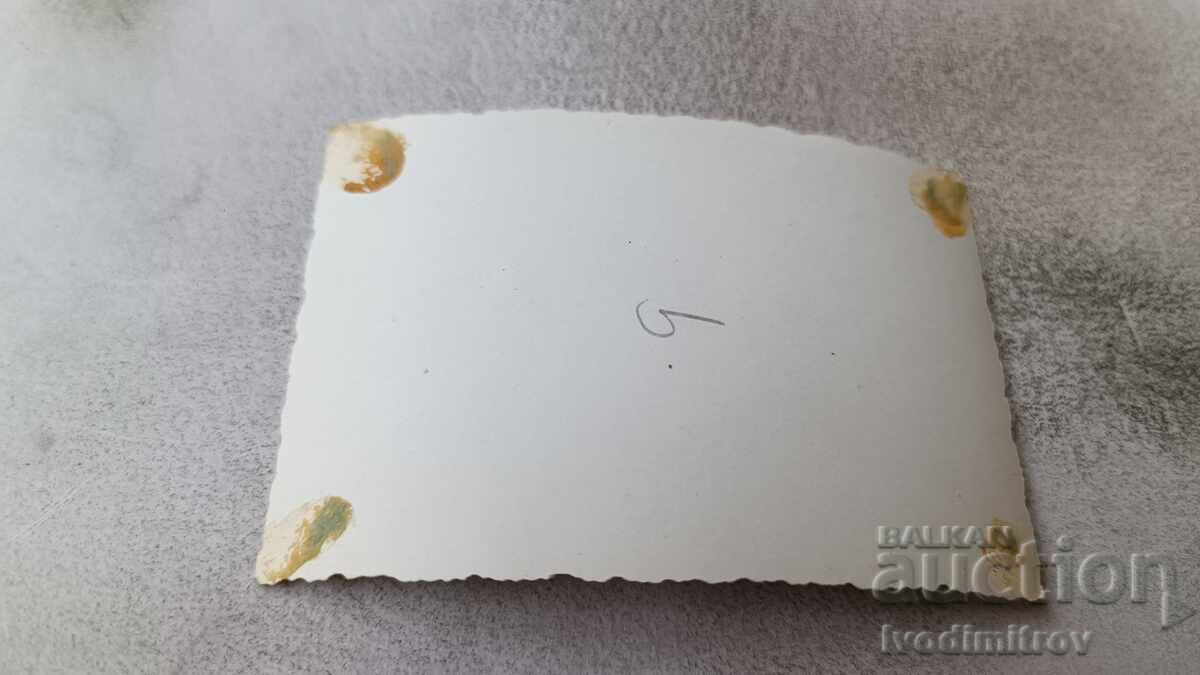 Photo A young man and a girl in swimsuits sitting on the grass with price 1.65 BGN | € 0.84 Photo A young man and a girl in swimsuits sitting on the grass with price 1.65 BGN | € 0.84