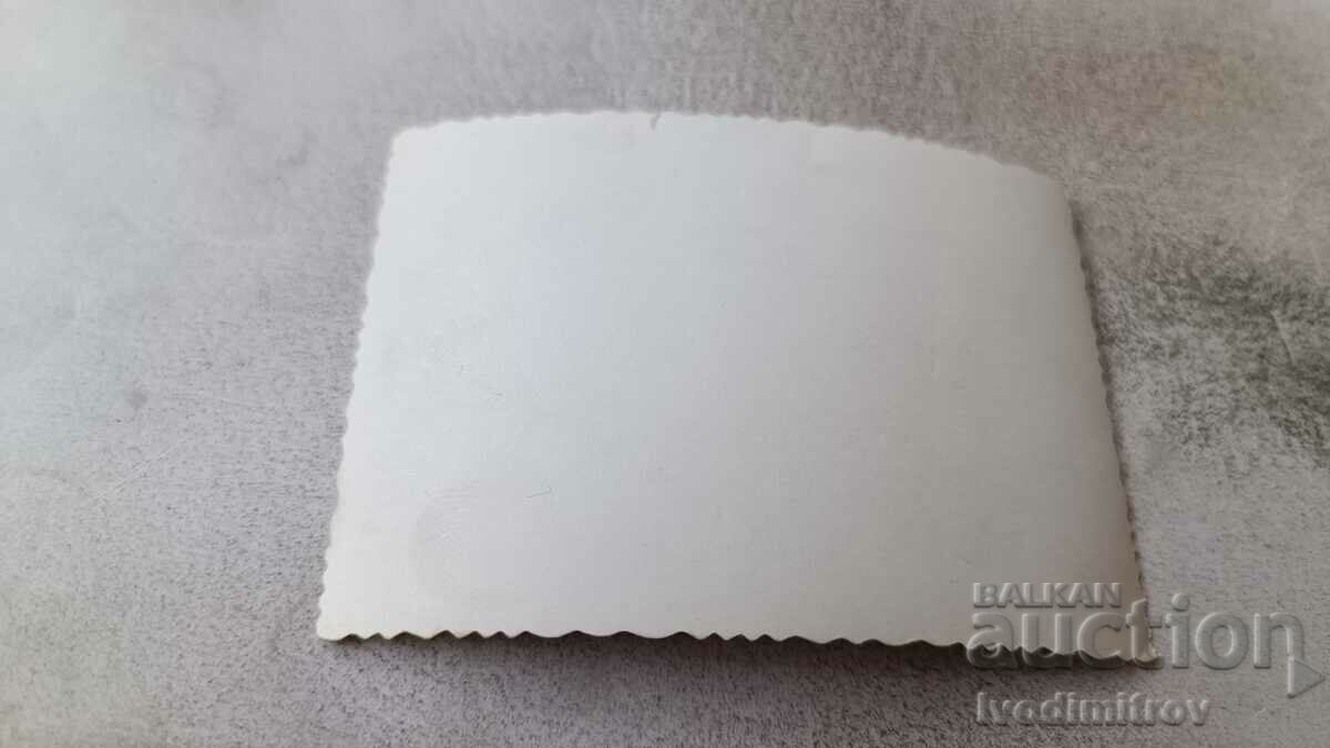 Photo A young girl in a swimsuit sitting on a rock by the sea with price 1.65 BGN | € 0.84 Photo A young girl in a swimsuit sitting on a rock by the sea with price 1.65 BGN | € 0.84