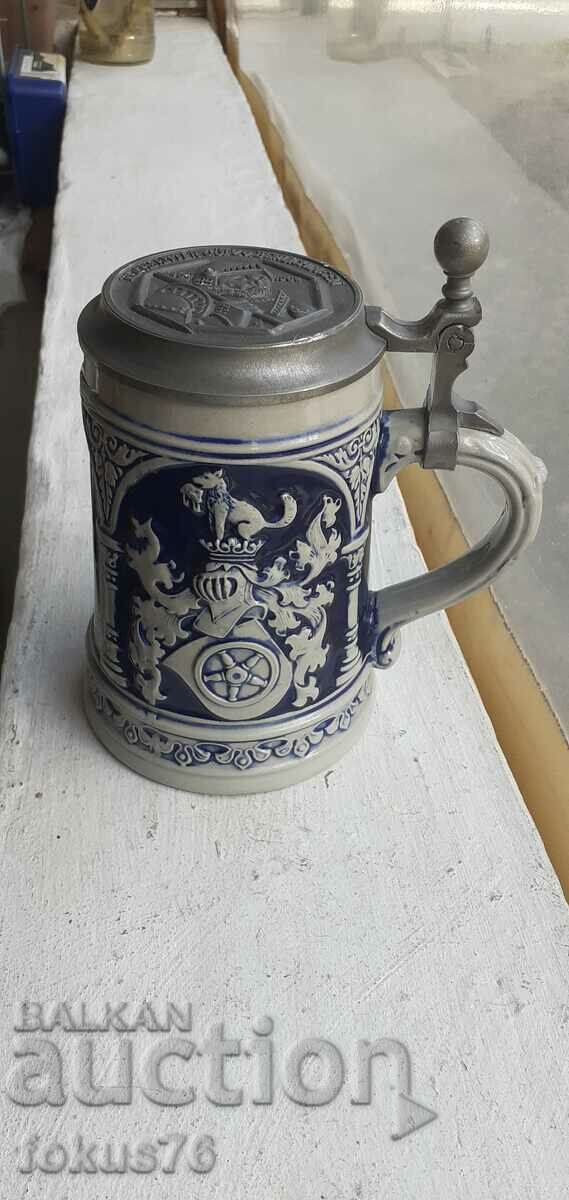Collectible German beer mug with lid marked