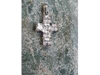 Silver cross with stones