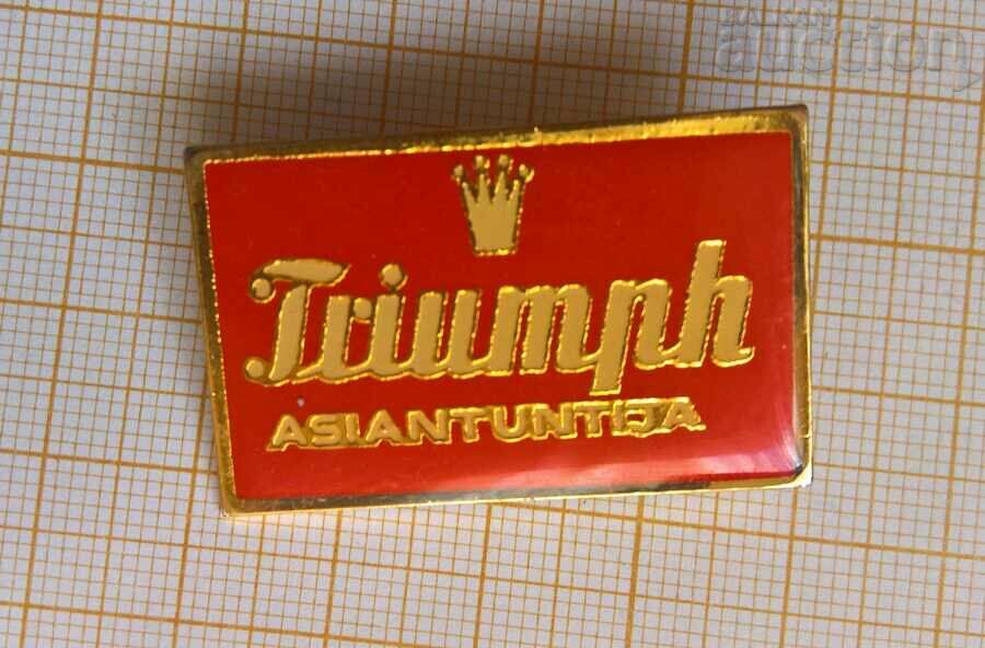 Triumph badge