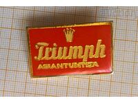 Triumph badge