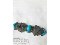 Silver brooch with turquoise