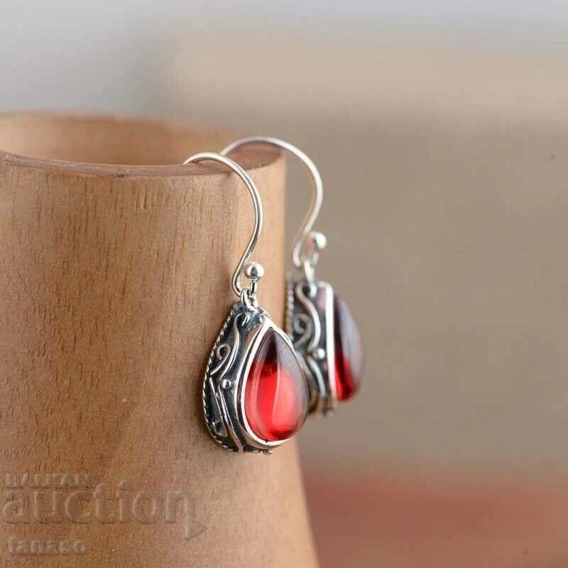 Earrings with red zircons