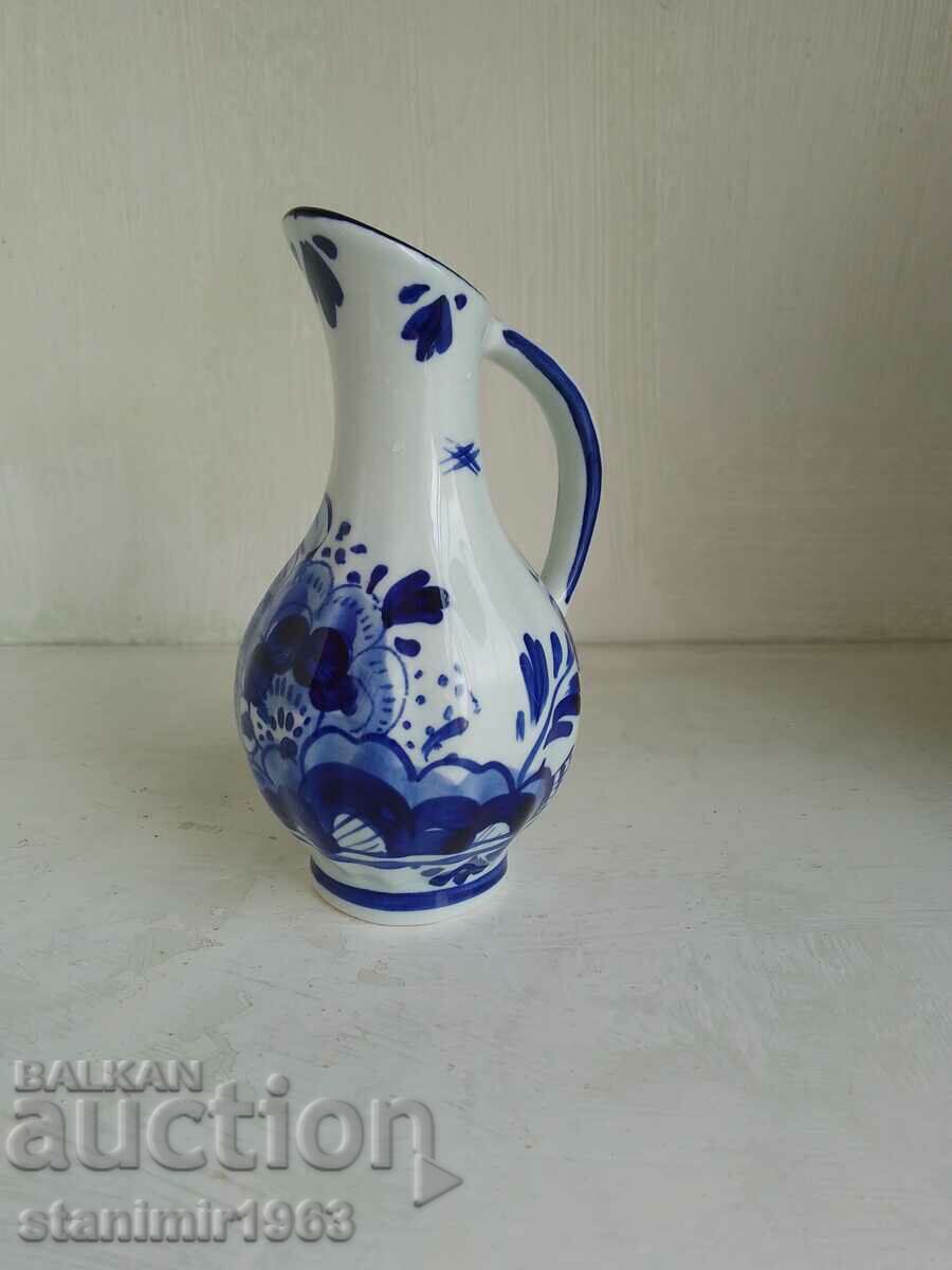 A beautiful vase, hand painted in porcelain, marked