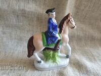 Porcelain figure of a nobleman on a horse