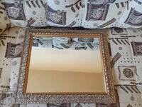 Faceted mirror in a beautiful wooden frame