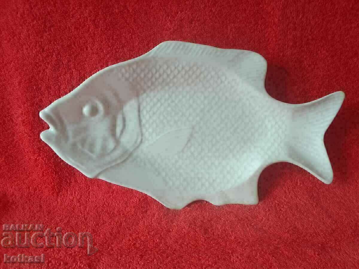 Old porcelain plate with a fish figure Old porcelain plate with a fish figure