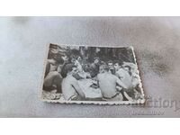 Picture Young men naked to the waist on a picnic