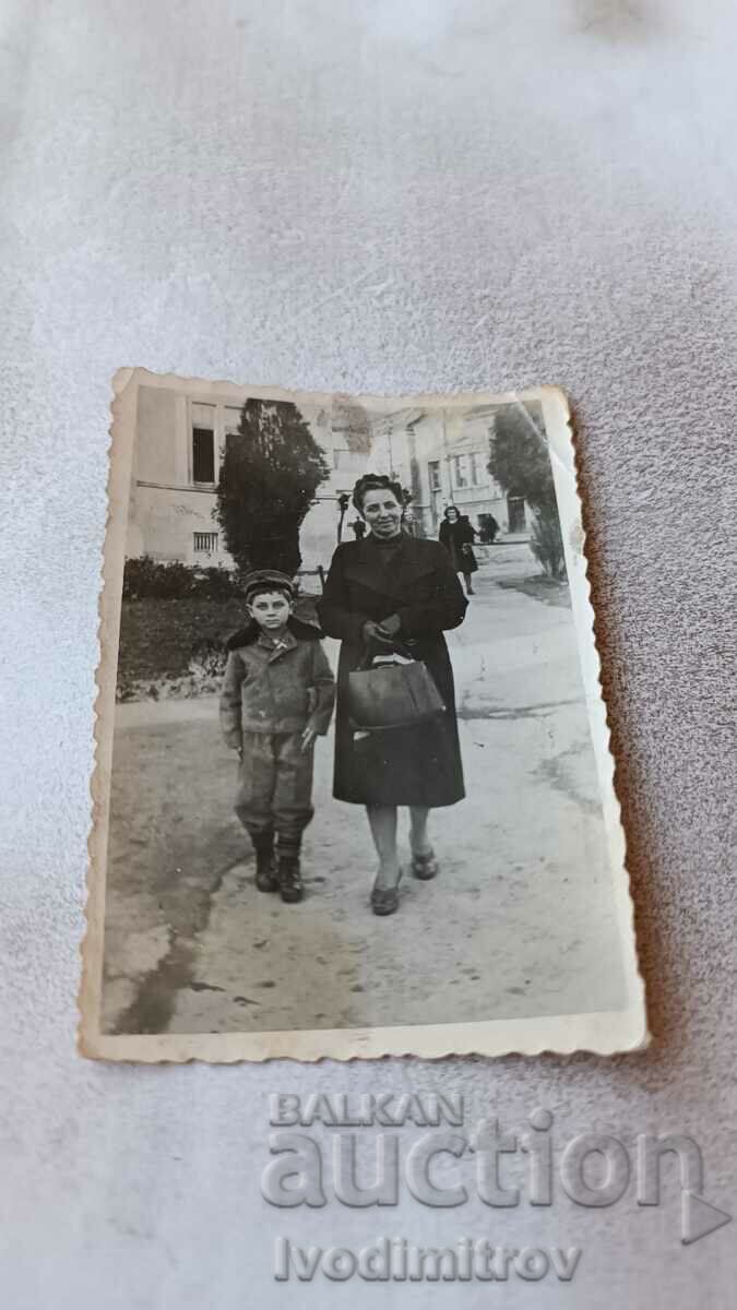 Photo Sofia A woman and a little boy on a walk 1947