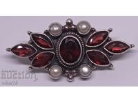 Silver brooch with garnet and pearls