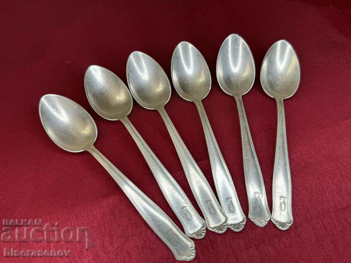 Silver plated spoons with markings