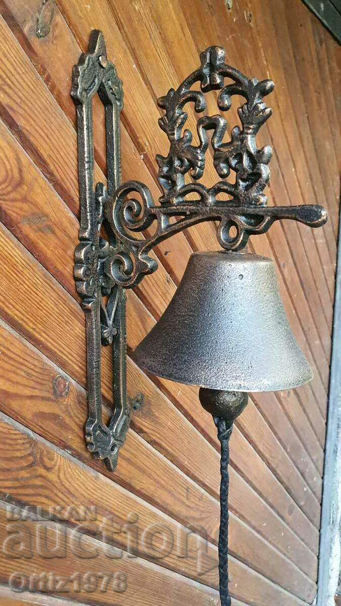 A large cast iron bell, with a loud, clear and resounding ring!