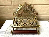 A beautiful baroque brass toilet paper holder