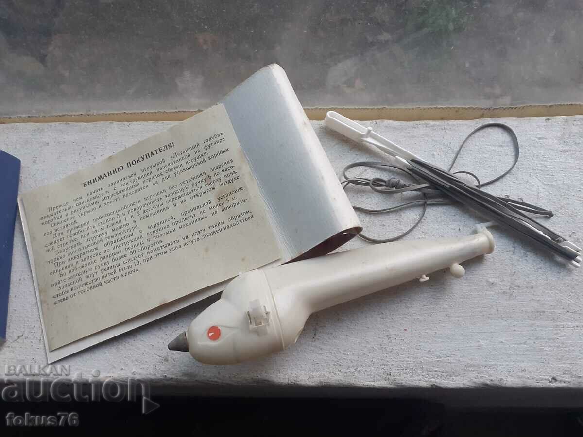 Delivery of Flying pigeon - Old Russian toy bird Delivery of Flying pigeon - Old Russian toy bird