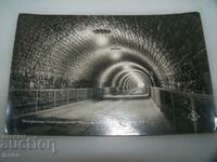 Old Austrian postcard of a tunnel on a high alpine road