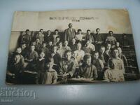 Old picture-card teacher and students in the classroom