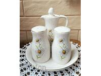 A great 4-piece ceramic set with daisies