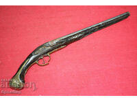 Old flintlock pistol without mechanism. For parts or repair.