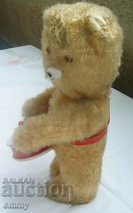 Livrarea Urs de jucărie mecanică, un urs care cântă la tobă. Cheia lipsește