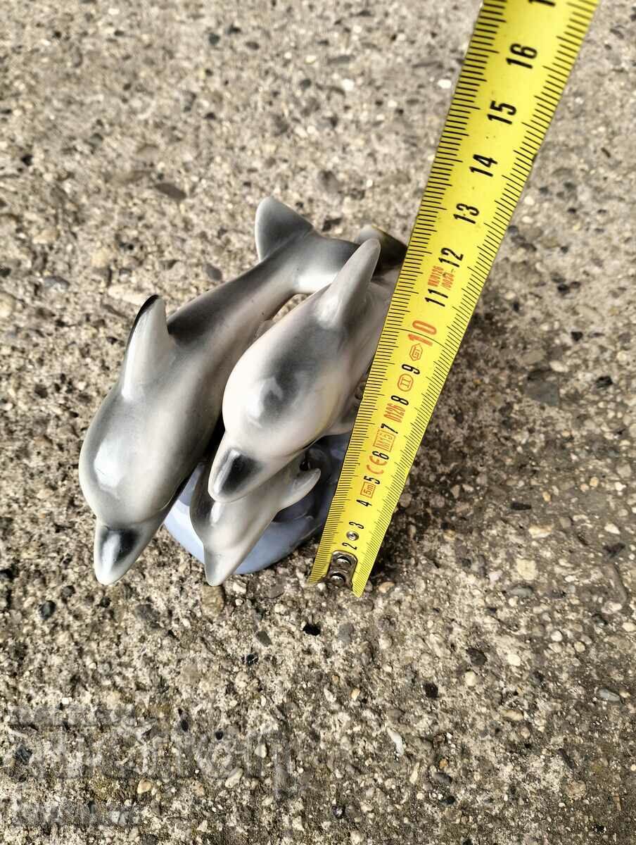 Auction  Porcelain figurine of dolphins