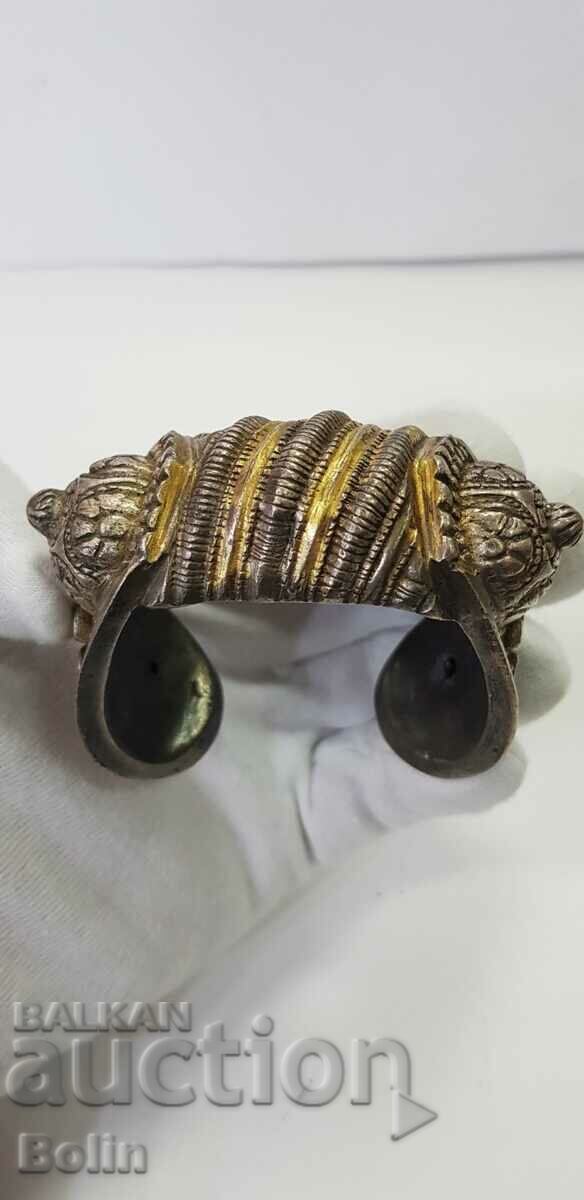 Delivery of A rare 19th century revival silver slingshot bracelet with gilding