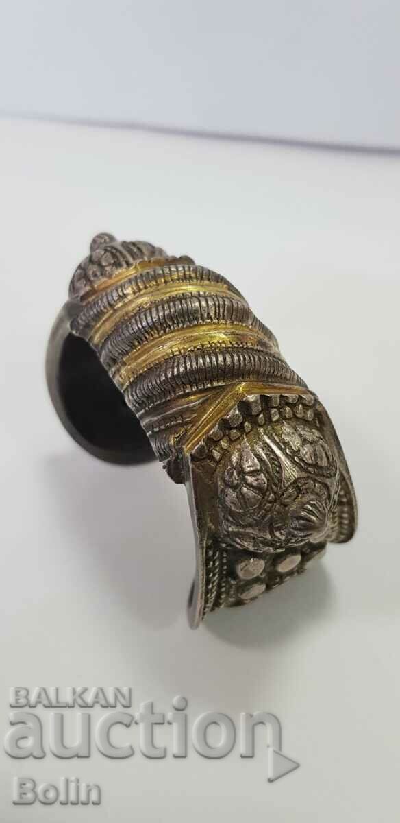 A rare 19th century revival silver slingshot bracelet with gilding