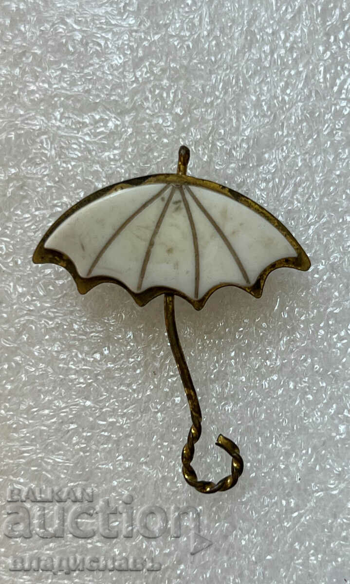 Umbrelă cu insignă interesantă