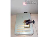 an old projection device with filmstrips from the 70s