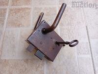 an old primitive lock with a key