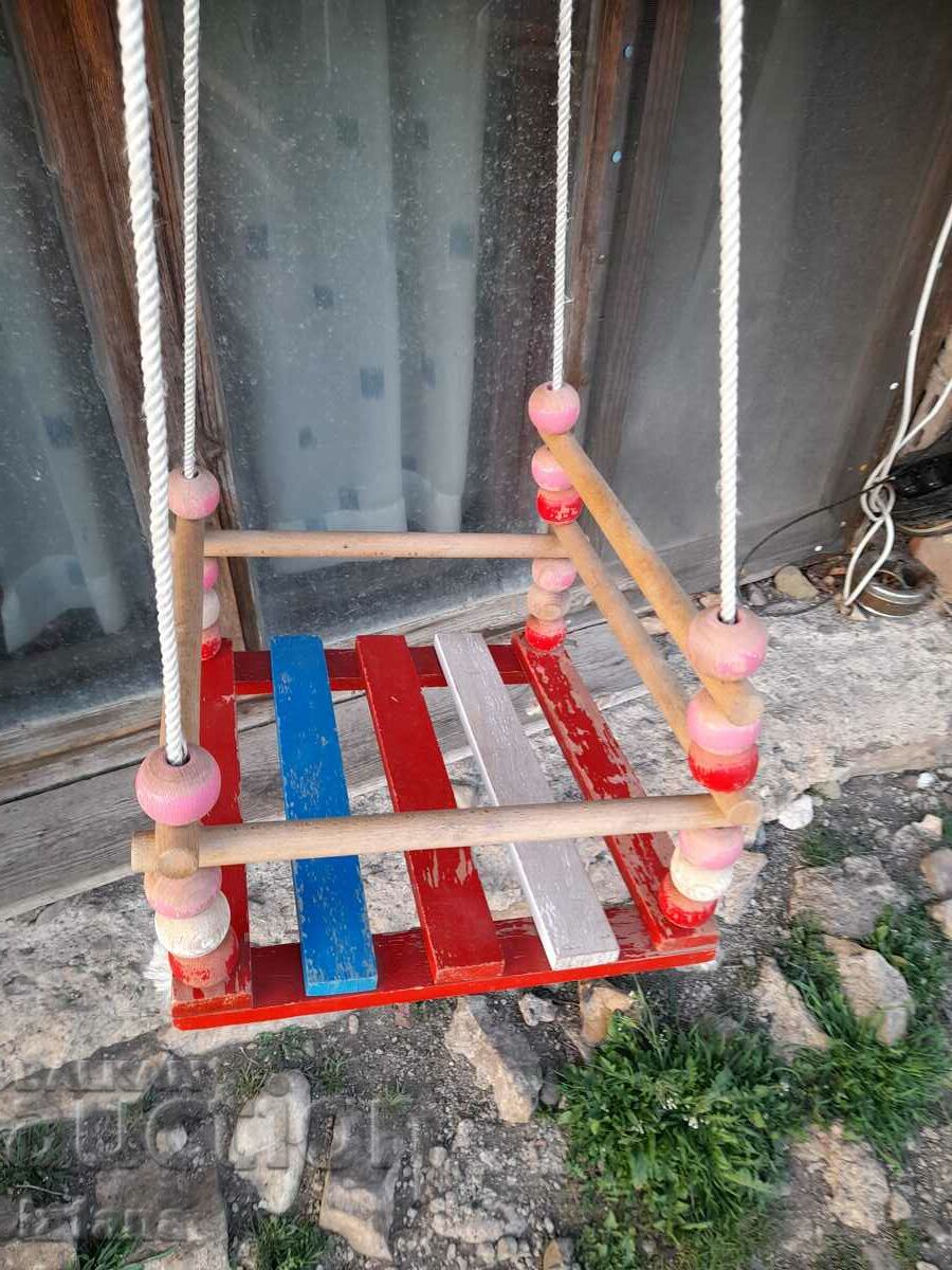 Old wooden children's swing with price 22.00 BGN | € 11.25 Old wooden children's swing with price 22.00 BGN | € 11.25