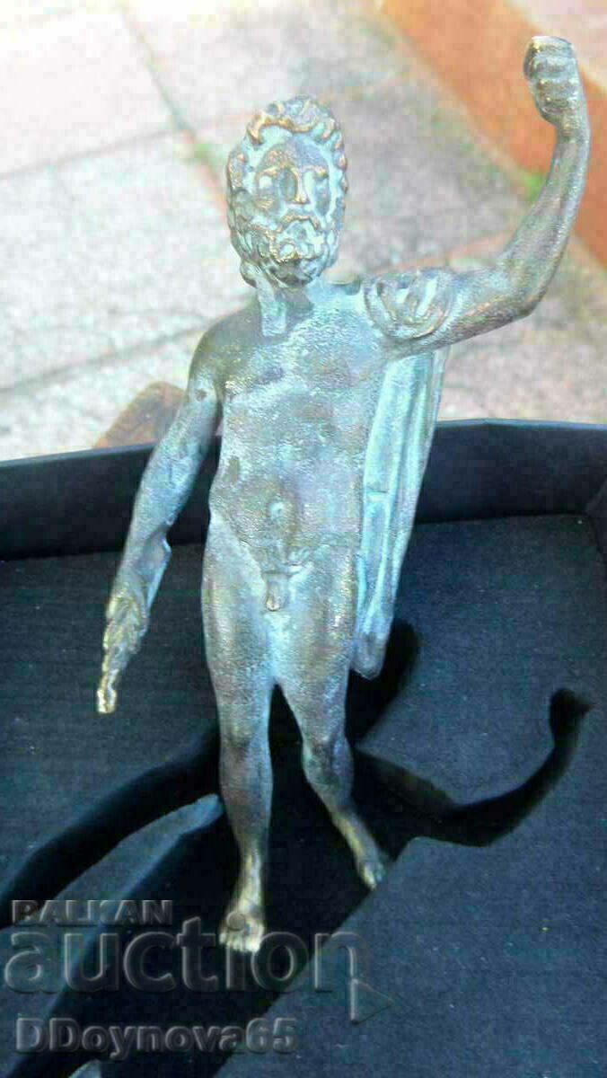 A bronze replica of a Roman or Greek god