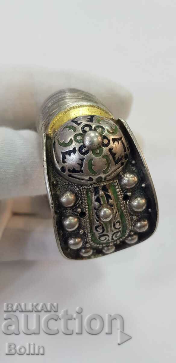 A rare 19th century silver gilt and beautiful enamel slingshot bracelet.