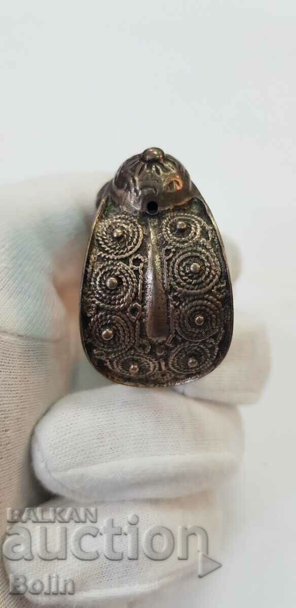 Auction A very rare model of a gilt revival slingshot bracelet Auction A very rare model of a gilt revival slingshot bracelet