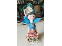 Old household folk figurine - a girl with a pitcher.