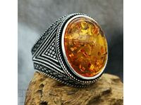 Elliptical cut amber ring