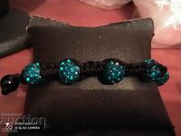 Dark blue spheres and textile bracelet