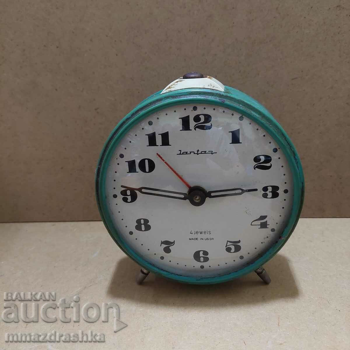 Old alarm clock Amber