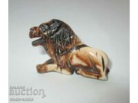 Very old handmade ivory lion figurine