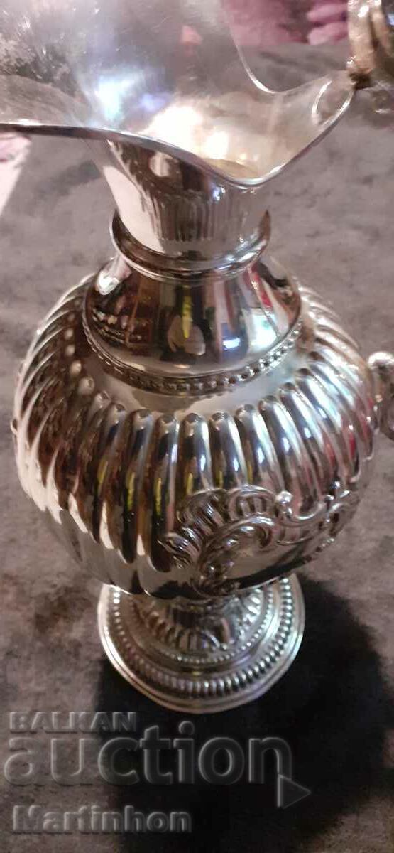 A large silver jug