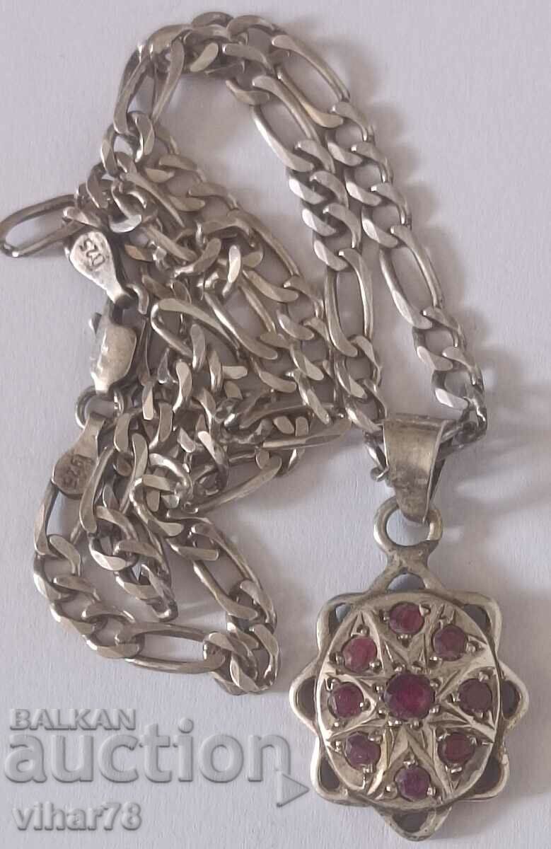 Old silver pendant with rubies