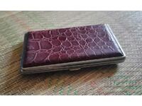 Old retro cigarette case - leather and metal.