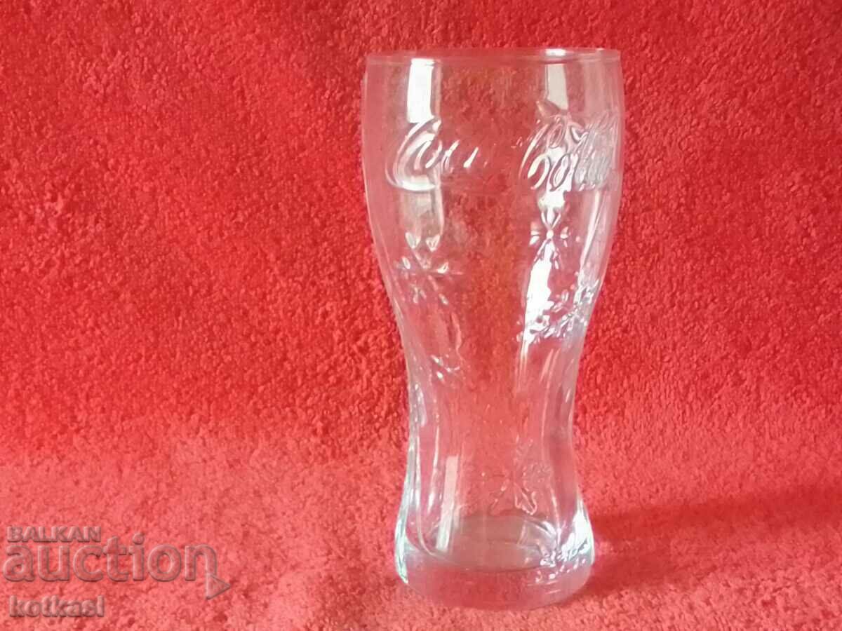 An old glass of Coca Cola Coca Cola