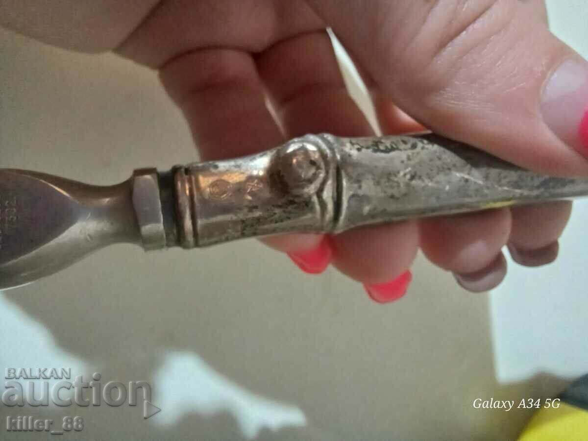 Delivery of Silver bottle opener Delivery of Silver bottle opener