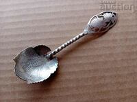 openwork handmade white metal spoon