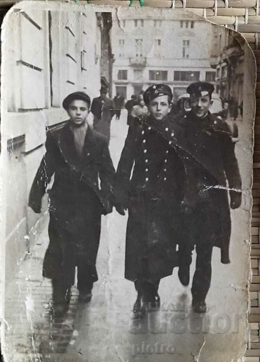 Old photograph photography - three young men, cadets.
