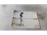 Photo Kiten Young woman on the beach 1966