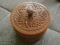 Round wooden cigarette box with carving